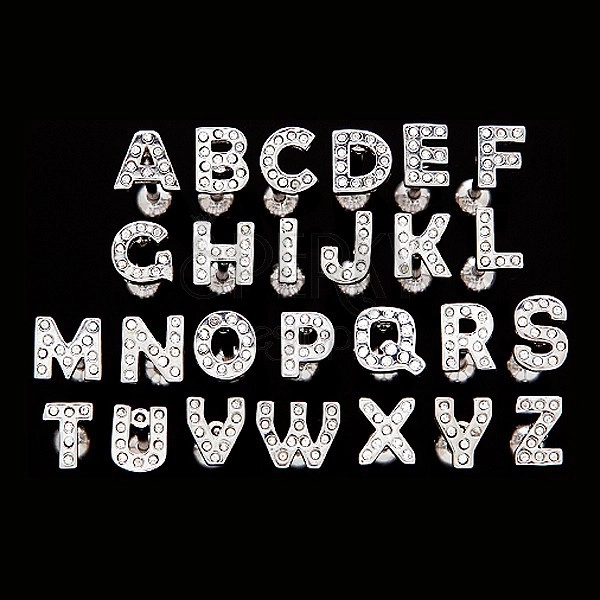 Nyelvpiercing acélból - cirkonköves betű