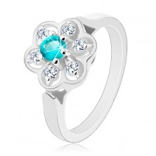 Csillogó gyűrű átlátszó virággal és világoskék színű középpel