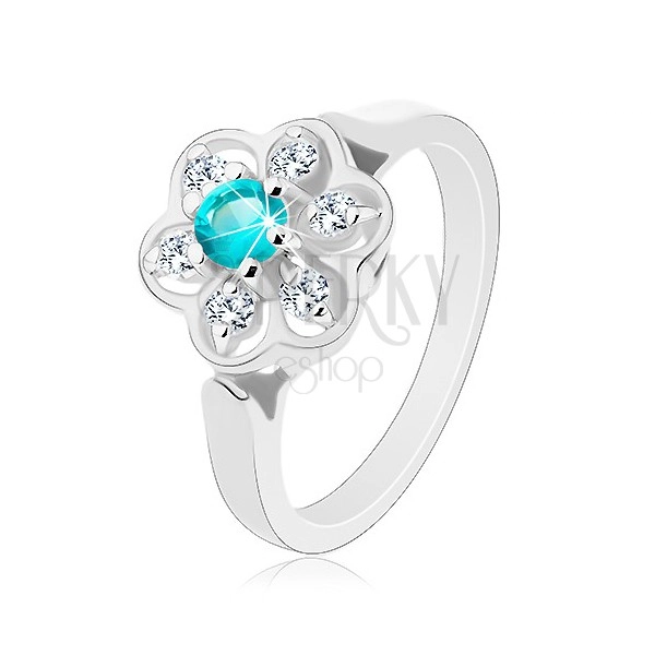 Csillogó gyűrű átlátszó virággal és világoskék színű középpel