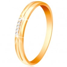 Sárga 585 arany gyűrű, szárak keskeny kivágással, átlátszó cirkóniák