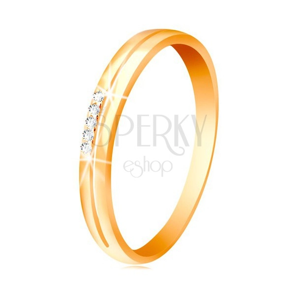Sárga 585 arany gyűrű, szárak keskeny kivágással, átlátszó cirkóniák