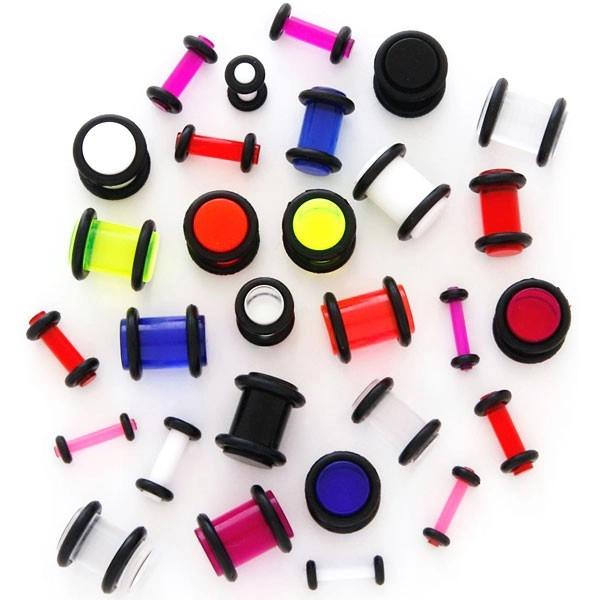 Fültágító - áttettsző UV, két fekete gumival - Vastagság: 1,5 mm, A piercing színe: Piros