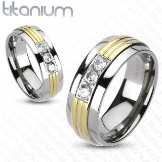 Titánium gyűrű - arany színű középső sáv, áttetsző cirkóniák - Nagyság: 64